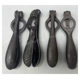 Four antique cast iron shell primers
