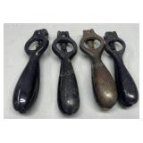 Four antique cast iron shell primers