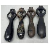 Four cast iron antique shell primers