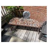 Outdoor iron and stone bench