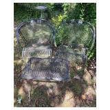 2 iron chairs and table