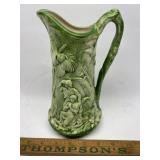 Green vintage ceramic pitcher