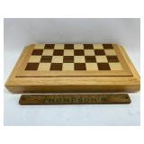 Folding game board with pieces