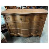 Antique oak serpentine front chest of drawers