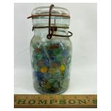 Blue jar with marbles