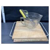 Measuring bowl , mixer and cutting board