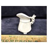 Pitcher with cat handle