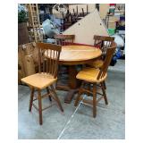 Bar height table with 4 swivel chairs