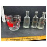 Measuring cup and bottles
