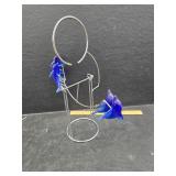 Swinging dolphin statue