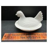 Plastic hen on the nest