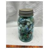 Vintage blue jar with marbles some uranium glass