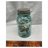 Vintage blue jar with sea shells