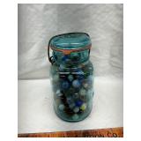 Vintage blue jar with marbles some uranium glass