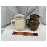 2 pottery pitchers