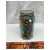 Vintage blue jar with marbles