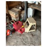 2 gas cans and a stool