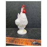 Rooster on a nest glass