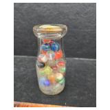 Milk glass with marbles