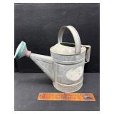Vintage galvanized watering can