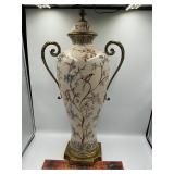 Porcelain urn trimmed with brass