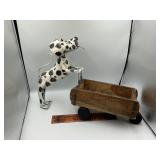 Metal dog pushing a wagon