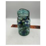 Blue jar with marbles