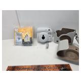 Instant camera with film