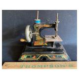 Antique casige toy sewing machine