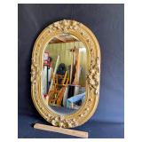 Oval gold framed mirror