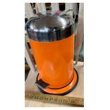 Small orange waste can