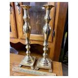 Pair of tall brass candlesticks