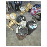 Three Industrial Gas Cylinders with Regulators
