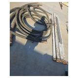 Lot of Industrial Hoses and Metal Pipes