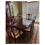 Dining Table with Eight Chairs Featuring Upholster