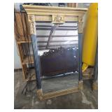 Ornate Gold-Framed Mirror with Carved Detailing