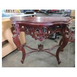 Wooden Table With Ornate Carvings