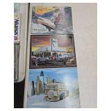 Three Metal Signs With Illustrated Designs