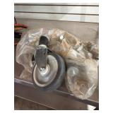 Four Metal and Rubber Swivel Casters