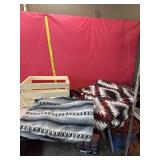 Wooden crate with throw blankets