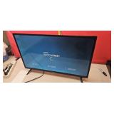 Vision  32" flat-screen  TV powers on no remote