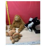 Throw blanket, stuffed dragon, & monkeys