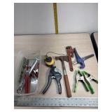 Clamps, pipe cutters, pipe wrench and hatchet