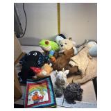 Lots of stuffed Animals and a cloth book