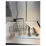 Vintage milk bottles, metal carrier and kitchen