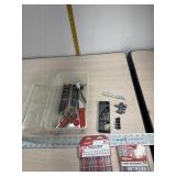 Shoe box with jig saw blades, razor blades hole