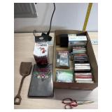 Tin toy shovel, cassette tapes, zip wall and