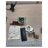 Earrings, darts, marbles, hand cuffs and jewelry