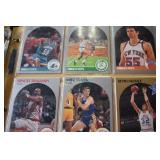 Baseball, Basketball and Football cards in binder