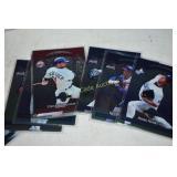 Baseball and football cards unsorted with empty